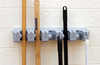 A Picture of product CFS-4073700 Brush & Broom Racks, Roll 'N Grip™ 16.5" Roll ’N Grip Plus Broom & Brush Holder 16.5" - Gray, 24 Each/Case.