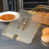 A Picture of product CFS-10431U13 StorPlus™ High Heat Handled Notched Universal Food Pan Lids, 1/2 Size. 12.75 X 10.38 X 0.88 in. Amber. 6 each/case.