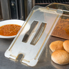 A Picture of product CFS-10471U13 StorPlus™ High Heat Handled Notched Universal Food Pan Lids, 1/3 Size. 12.75 X 7.00 X 0.88 in. Amber. 6 each/case.